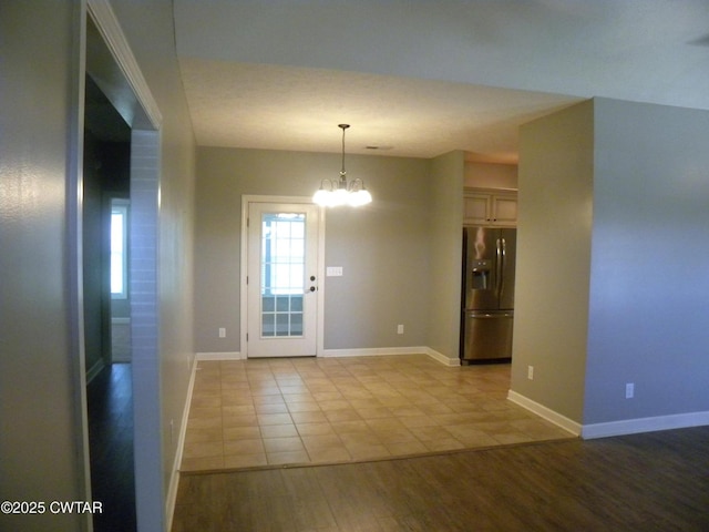 85 Neshova Ln, Henderson, TN 38340 - interior space with an inviting chandelier, baseboards, and wood finished floors