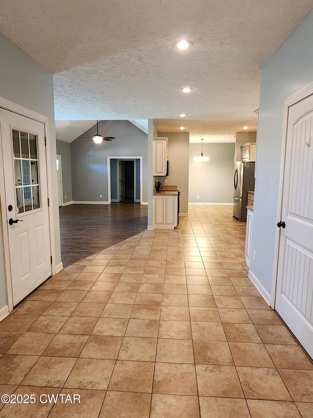 85 Neshova Ln, Henderson, TN 38340 - unfurnished living room with recessed lighting, a textured ceiling, light tile patterned floors, and baseboards