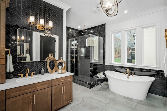 7258 Murrel Dr, Franklin, TN 37064 - bathroom featuring crown molding, tile walls, a stall shower, vanity, and a chandelier