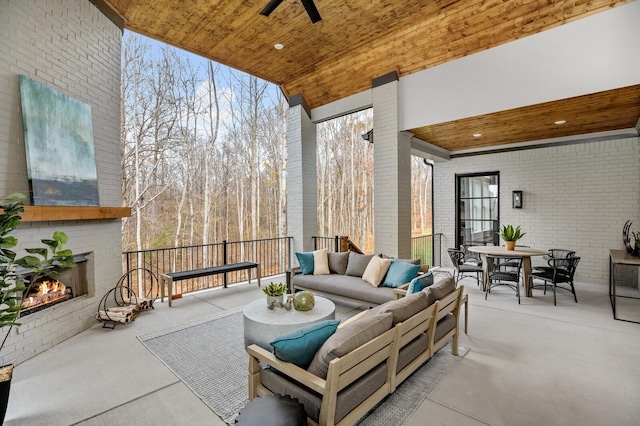7258 Murrel Dr, Franklin, TN 37064 - view of patio / terrace featuring a ceiling fan, an outdoor living space with a fireplace, and outdoor dining space