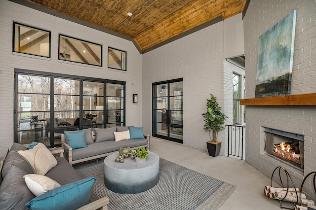 7258 Murrel Dr, Franklin, TN 37064 - exterior space featuring finished concrete floors, wood ceiling, a brick fireplace, and high vaulted ceiling