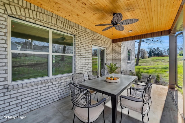 view of patio with ceiling fan and outdoor dining space
