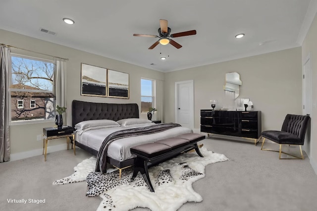 bedroom with baseboards, ornamental molding, carpet, and visible vents