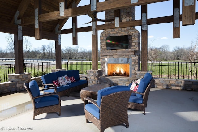 152 Salton Ln, Spring Hill, TN 37174 - view of patio with a gazebo, an outdoor living space with a fireplace, and fence