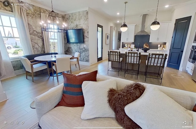 152 Salton Ln, Spring Hill, TN 37174 - living room featuring light wood-type flooring, recessed lighting, crown molding, and a notable chandelier