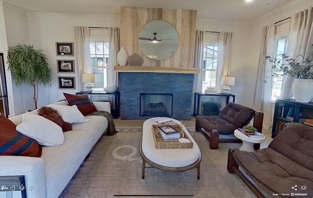 152 Salton Ln, Spring Hill, TN 37174 - living room featuring crown molding, a ceiling fan, and a fireplace