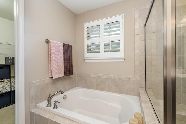bathroom with a garden tub and a stall shower