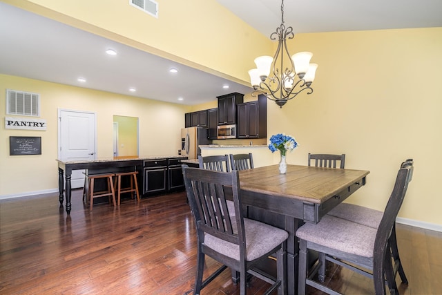 dining room with recessed lighting, visible vents, an inviting chandelier, and dark wood finished floors