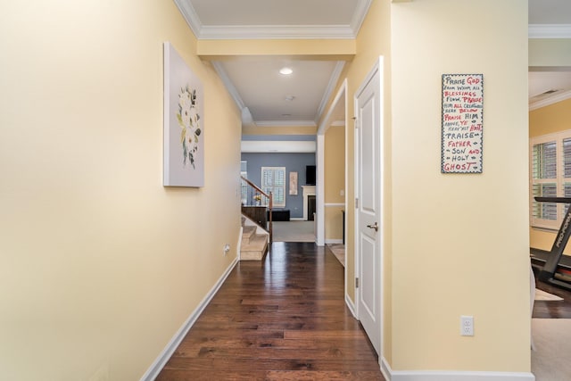 hallway featuring stairs, wood finished floors, baseboards, ornamental molding, and recessed lighting