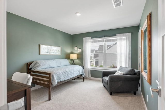 carpeted bedroom with baseboards and visible vents