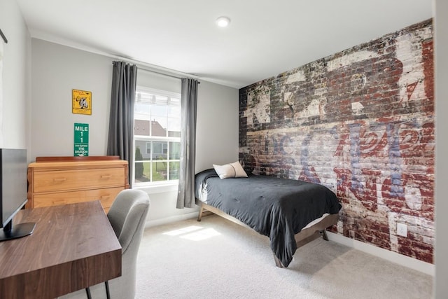 bedroom featuring baseboards, carpet flooring, and an accent wall