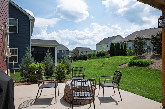 view of patio with fence and a residential view