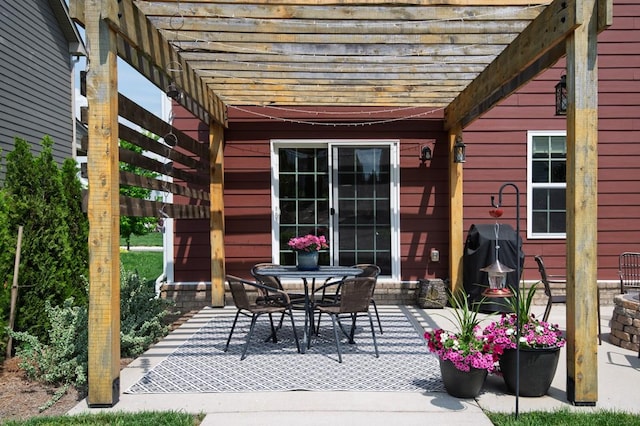 view of patio with a pergola and outdoor dining space