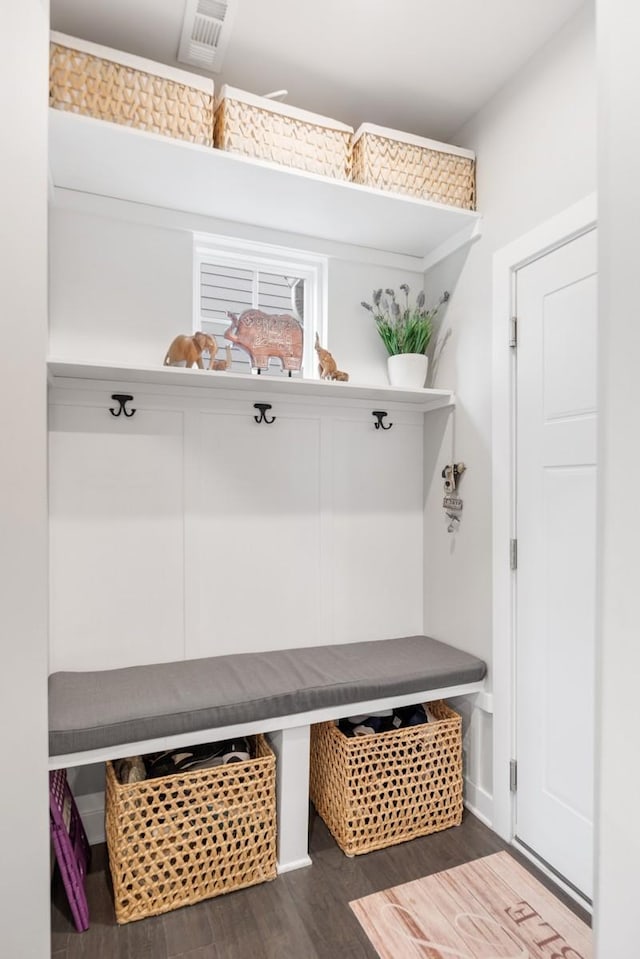 mudroom featuring dark wood-style flooring and visible vents