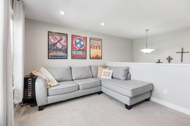 living area featuring recessed lighting, carpet, and baseboards