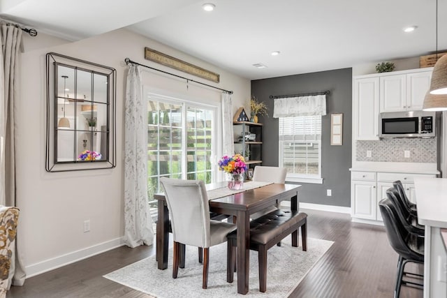 dining space with baseboards, recessed lighting, and dark wood-type flooring