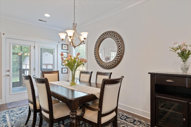 206 Hart Ln, Lebanon, TN 37087 - dining room with baseboards, a notable chandelier, visible vents, and wood finished floors