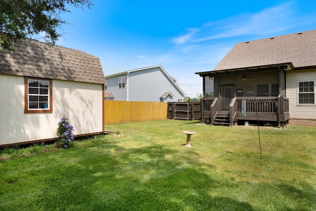 206 Hart Ln, Lebanon, TN 37087 - view of yard featuring fence, a wooden deck, an outbuilding, and a storage shed