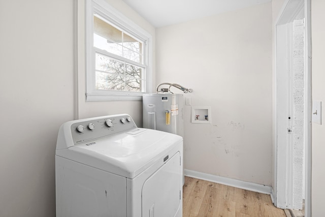 clothes washing area with laundry area, light wood-style floors, washer / clothes dryer, baseboards, and electric water heater