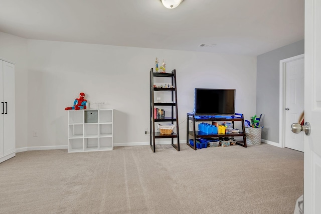 rec room featuring baseboards, carpet, and visible vents