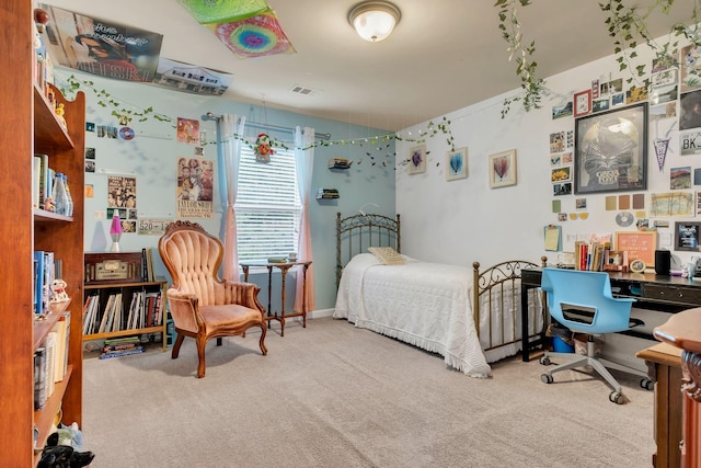 bedroom with visible vents, carpet flooring, and baseboards