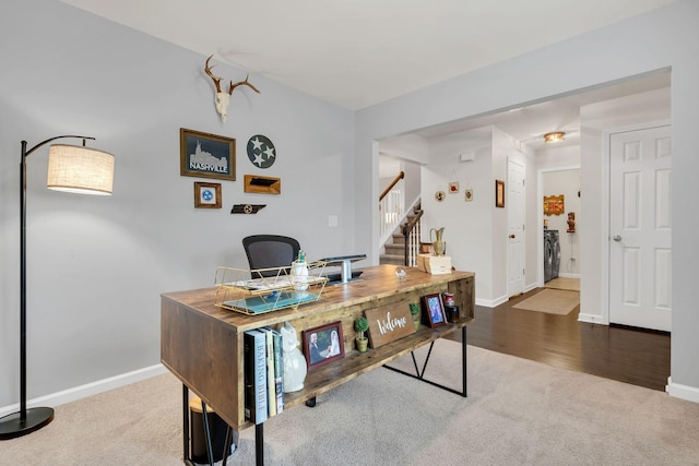 carpeted home office with baseboards