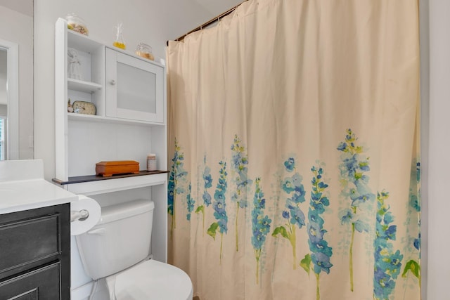 full bathroom featuring toilet and vanity
