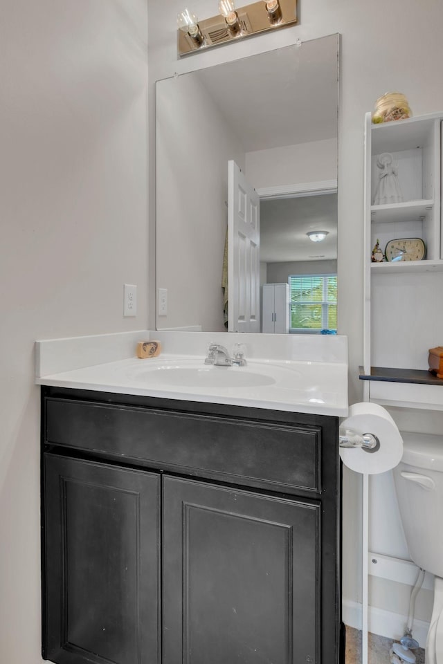 bathroom with vanity and toilet