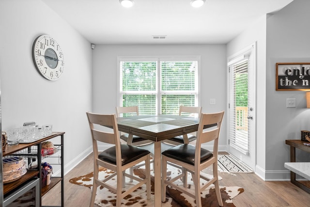 532 Herman Dr, Clarksville, TN 37042 - dining room featuring wine cooler, light wood-type flooring, and baseboards