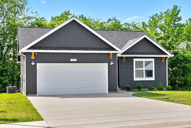 532 Herman Dr, Clarksville, TN 37042 - view of front of home featuring cooling unit, a garage, concrete driveway, and a shingled roof