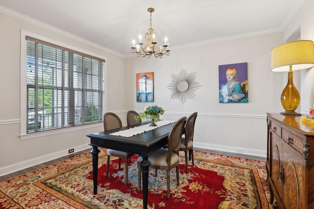 dining area with an inviting chandelier, ornamental molding, plenty of natural light, and wood finished floors