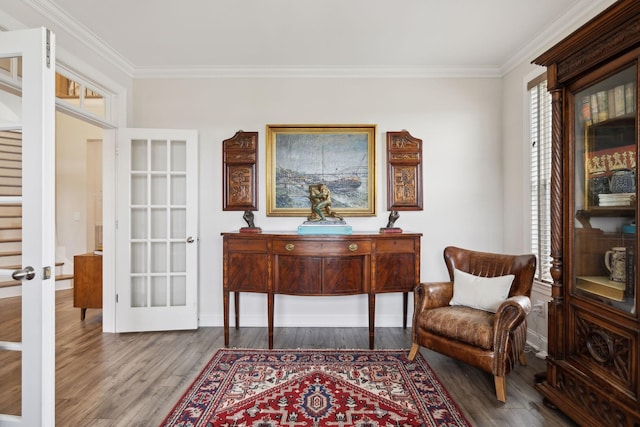 sitting room featuring crown molding, baseboards, french doors, and wood finished floors