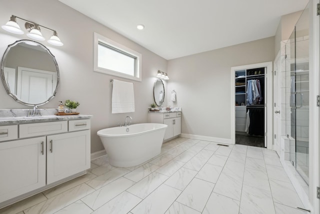 full bath featuring baseboards, a stall shower, and marble finish floor