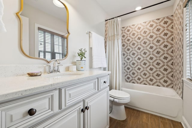 full bath featuring shower / bathtub combination with curtain, wood finished floors, a wealth of natural light, and toilet