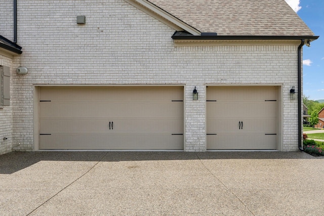 garage featuring driveway