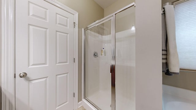full bathroom with a stall shower