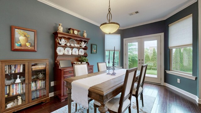 dining space featuring ornamental molding, visible vents, dark wood finished floors, plenty of natural light, and baseboards