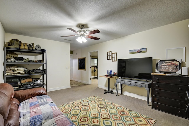 carpeted living room featuring baseboards, a ceiling fan, a textured ceiling, and visible vents