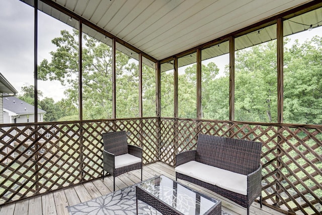 sunroom with an outdoor living space