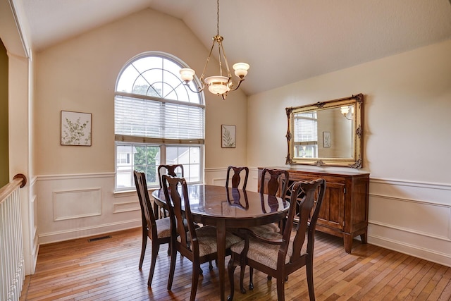 dining space featuring a chandelier, a healthy amount of sunlight, and light wood-style floors