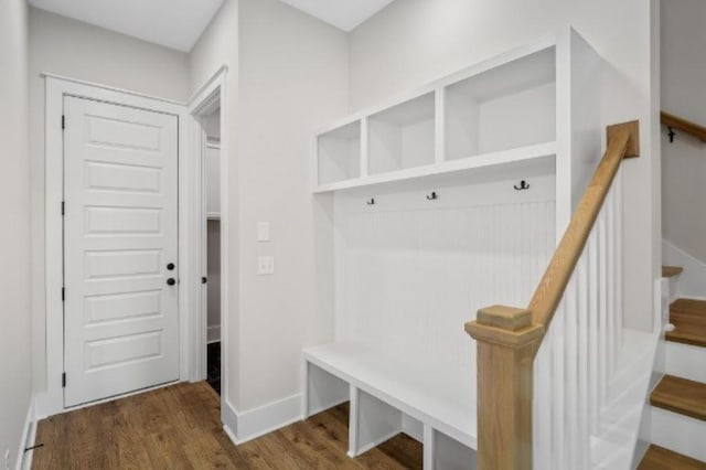mudroom featuring baseboards and wood finished floors