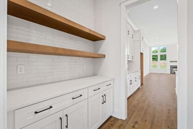 corridor featuring recessed lighting and wood finished floors