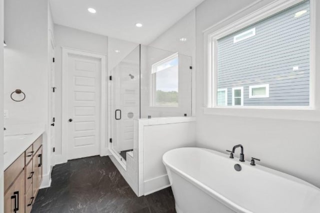 full bathroom featuring vanity, marble finish floor, recessed lighting, a soaking tub, and a shower stall