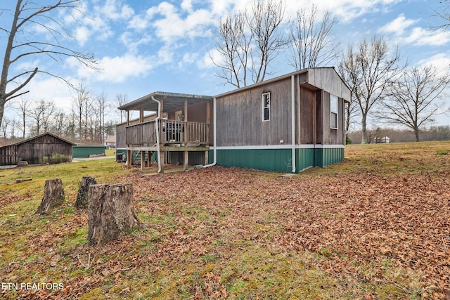 back of property with a wooden deck