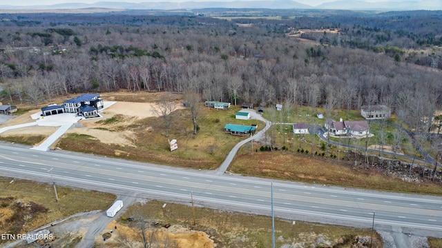 aerial view featuring a mountain view and a forest view