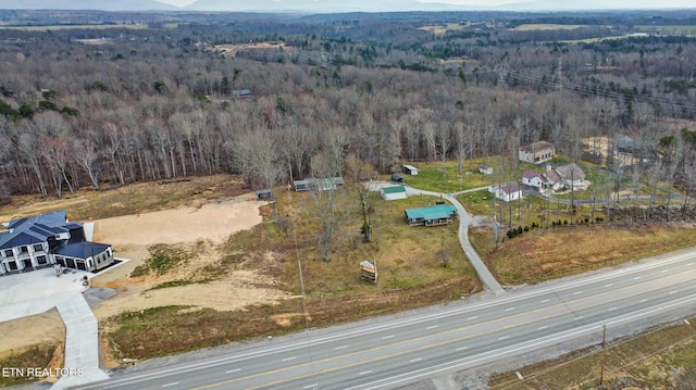 bird's eye view featuring a forest view
