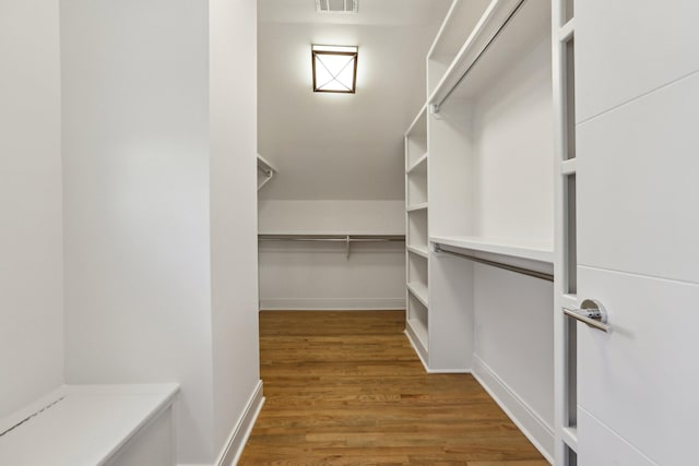 spacious closet with wood finished floors and visible vents