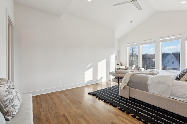 bedroom featuring ceiling fan, high vaulted ceiling, recessed lighting, baseboards, and wood finished floors