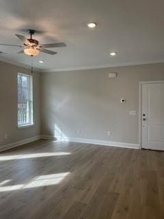 empty room featuring a ceiling fan, baseboards, recessed lighting, and wood finished floors
