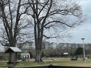 view of property's community featuring fence